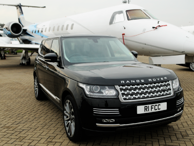 First Class Cars' Range Rover with a Private Jet airside